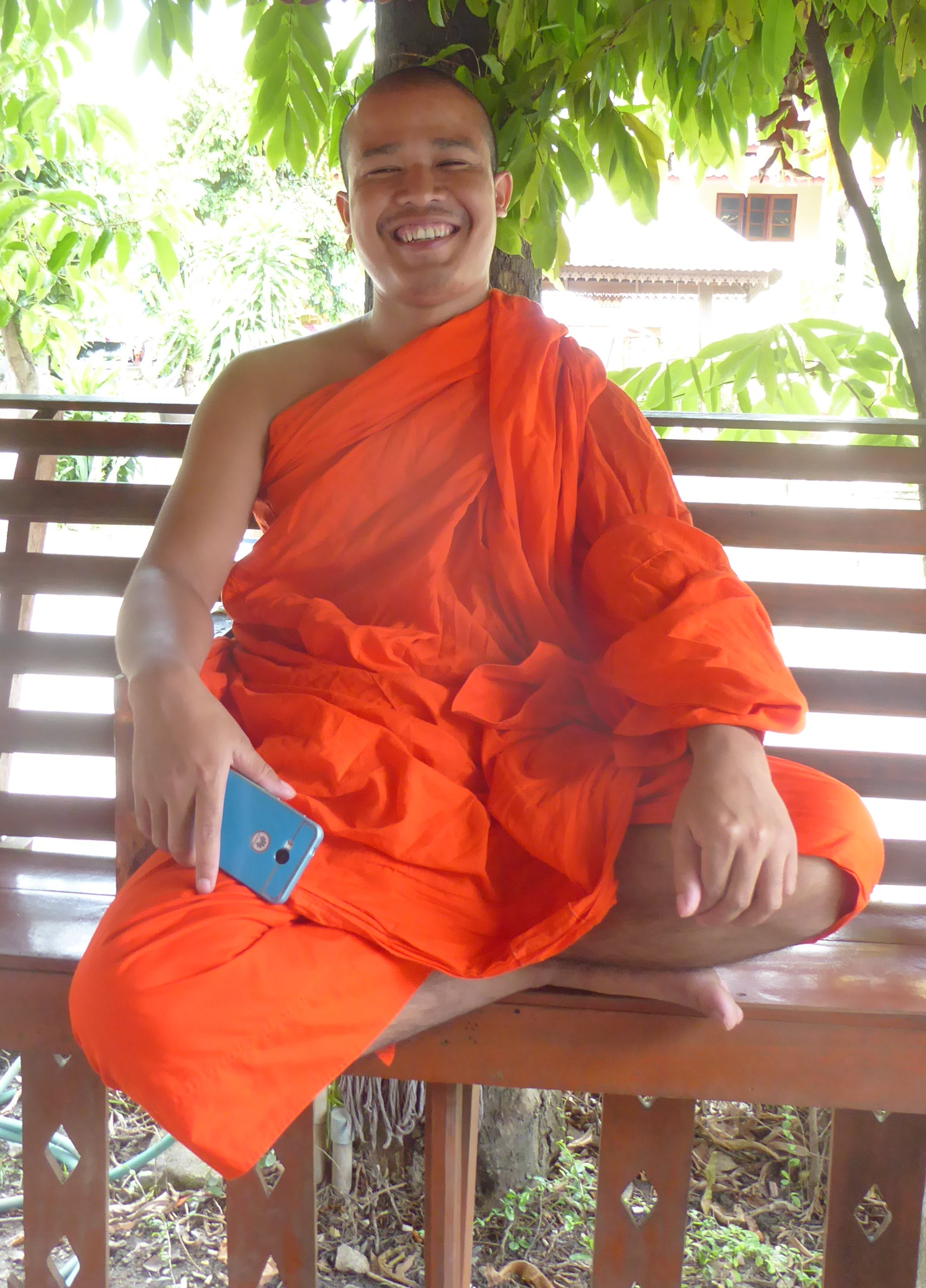 a happy monk named Phra Nanta at a temple in Chiang Mai
